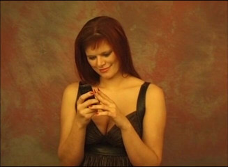Gazongas: On her phone and showing boobs