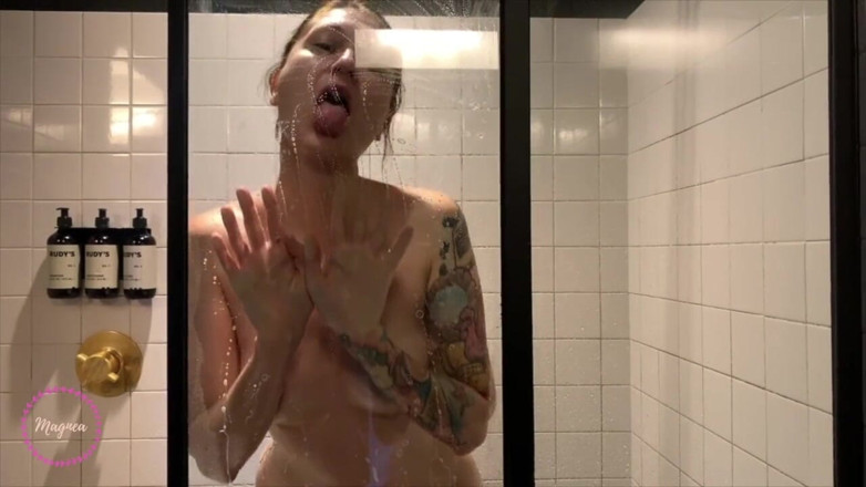 Magnea: Tattooed girl Magnea rubs her pussy in the shower