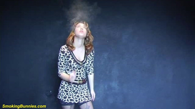 Smoking Bunnies: Busty redhead smoking and stripping