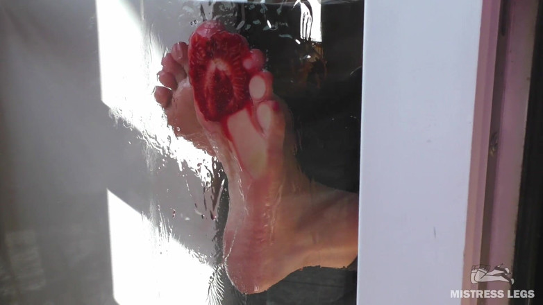 Mistress Legs: Mistress barefoot soles rubbing against the glass and squeezing strawberries