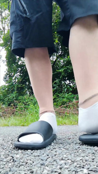 In Slippers and White Socks in Nature