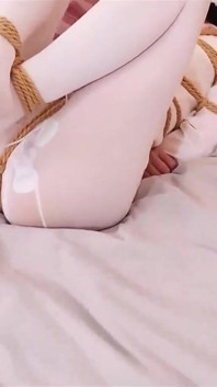 Pink Jk Girl's Turtle Shell Is Tied up in Multiple Bundles