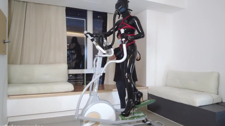 Aisan girl bondage: Mz27 - a Girl Bound in Latex Walks on a Treadmill