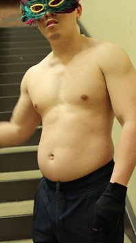 Flexing by the Stairs at the Gym