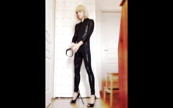 Faustine: Crossdresser Faustine vinyl catsuit with necklace.