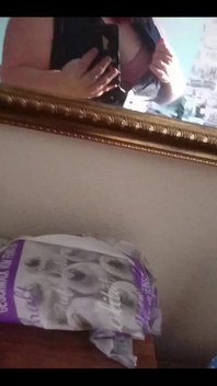 Showing off in a cool lab coat in front of the mirror