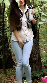 Desperate Brunette in a Forest Holding Her Crotch to Stop Herself From Pissing in Her Jeans