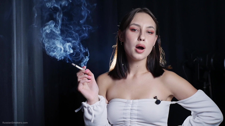 Russian Smokers: Elegant Brunette Smoking Cigarette in Dark Studio Scene