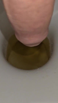 Male Peeing Into the Toilet