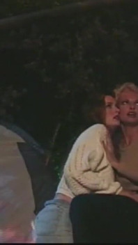 A Brunette and a Blonde with Huge Tits Have Sex in Front of the Campfire