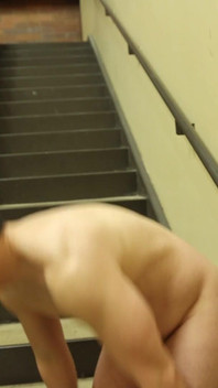 Flexing by the Stairs at the Gym