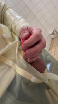 Putting a Condom on in Transparent Latex Raincoat