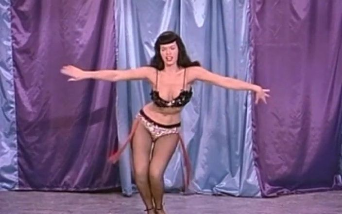 Vintage megastore: Classic brunette domina with whip shows off her body