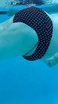 Couple Underwater Diving and Swimming