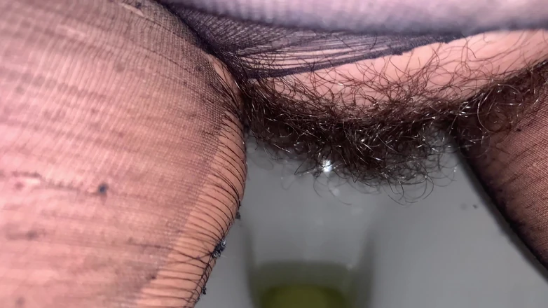 CoppiaCollant: On the Toilet in Pantyhose the MILF Pisses and Then...