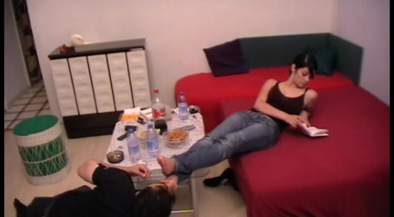 Femdom Austria: Licking feet by the coffee table