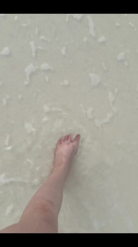 Running my bare feet on the white beach sand by the ocean.