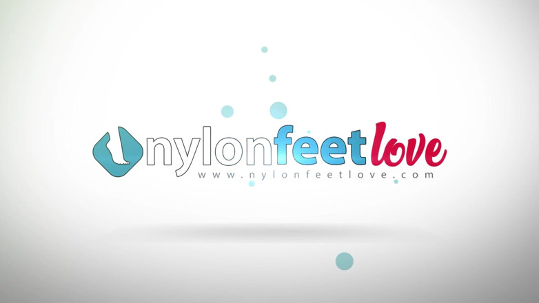 Best Nylon Feet Videos: Gorgeous brunette with inked body showing her feet in fishnet...