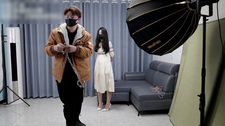 Asian bondage: Girlfriend in a Dress and Stockings, Bound by Rope