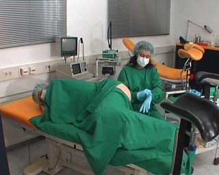 Rubber & Clinic Studio - 1ATOYS: Nurse in green surgery outfit