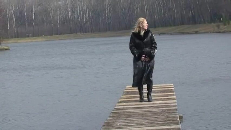Femdom Austria: Bitch in leather pissing on a pier