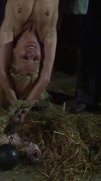 Witch Hangs Upside Down and Gets Drizzled with Black Wax