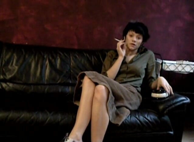 Femdom Austria: Black haired teen smoking a cigarette