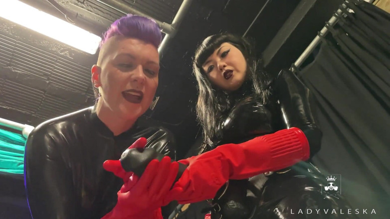 Lady Valeska: Latex Dommes invite you to suck their huge strap ons