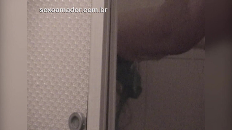 Amateurs videos: Amateur video of young brunette taking a shower with an...