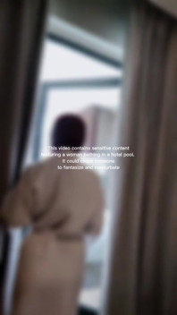 Woman Hijab Bathing Naked in an Open-air Hotel Pool