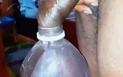 Pissing in a Large Juice Container