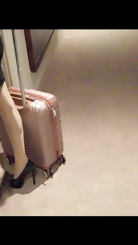 MILF in Stockings and Heels Walks Through the Corridors of a Hotel