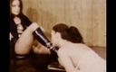 Vintage megastore: Lesbian Mistress in Leather Dress and Black Boots Dominating a...