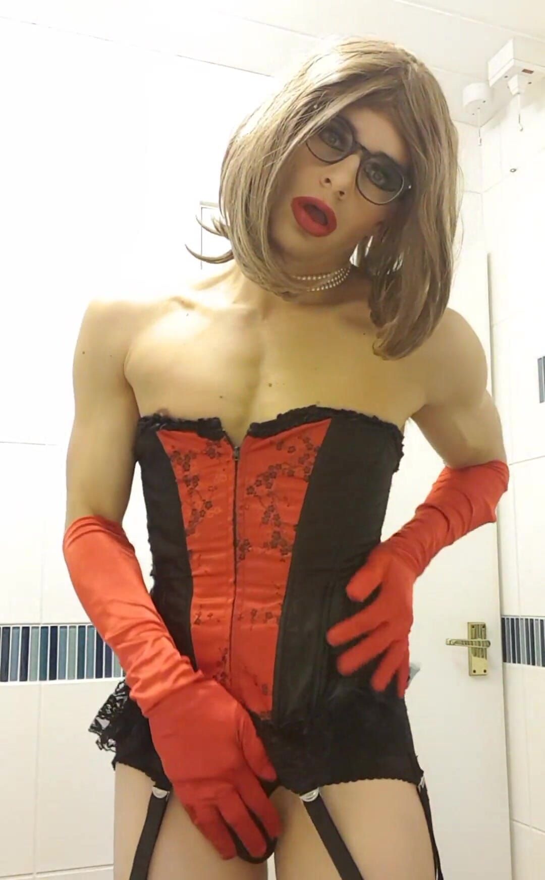 Kinky Brunette showing off her pussy xxx Black Red Corset, stockings, 6 strap suspenders, lace underwear, red opera satin glove