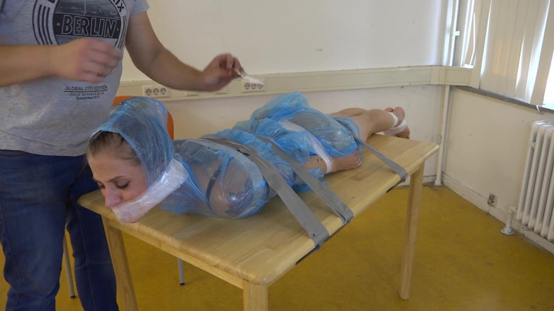 Restricting Ropes: Taped to their work desk