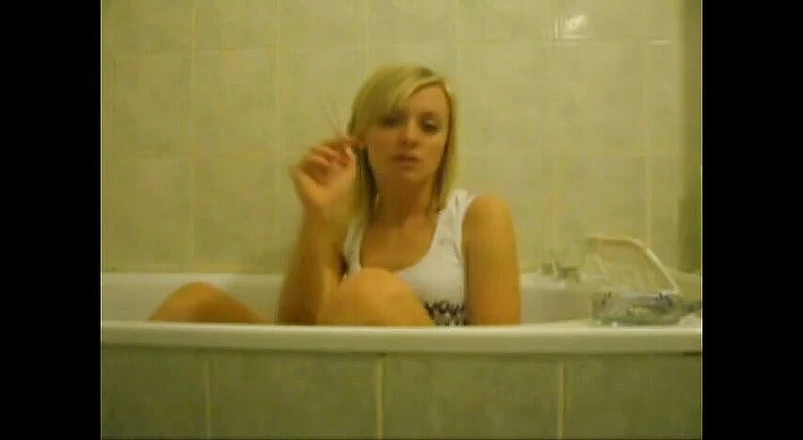 Femdom Austria: Blonde bitch in the bathtub smoking cigarettes