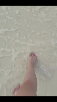 Running my bare feet on the white beach sand by the ocean.