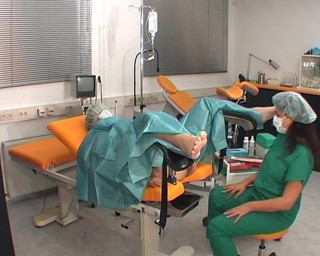 Rubber & Clinic Studio - 1ATOYS: Nurse in green surgery outfit