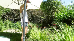 Alexa Cosmic Trans Girl Wetting & Wetlook in the Garden in White T-shirt and Denim Shorts Under Water From a Hose... thumbnail