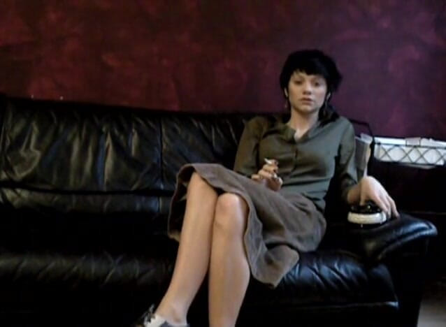 Femdom Austria: Black haired teen smoking a cigarette