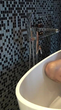 Chubby Stepdaddy Pissing in Bathtub