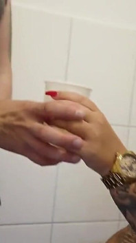 Tattooed Blonde Pees Into the Cup at the Toilet and Gets a Body Shot