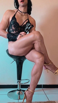 Crossdresser Teasing in Fishnets and High Heels