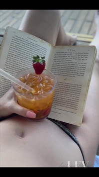 Reading by the Pool in a Bikini That Barely Counts as Spf
