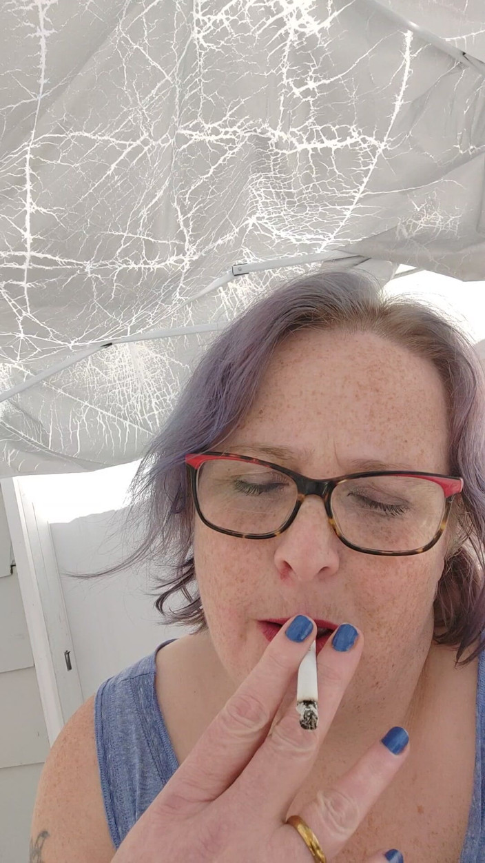 AngYourDirtyCanadian: Calm Outdoor Smoking Moment with a Playful Lipstick Look
