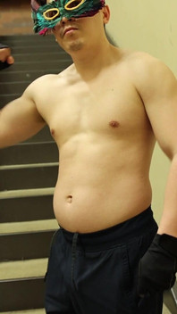 Flexing by the Stairs at the Gym