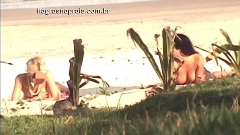 Amateurs videos: Wonderful blonde and brunette take sunbathing naked on a beach...