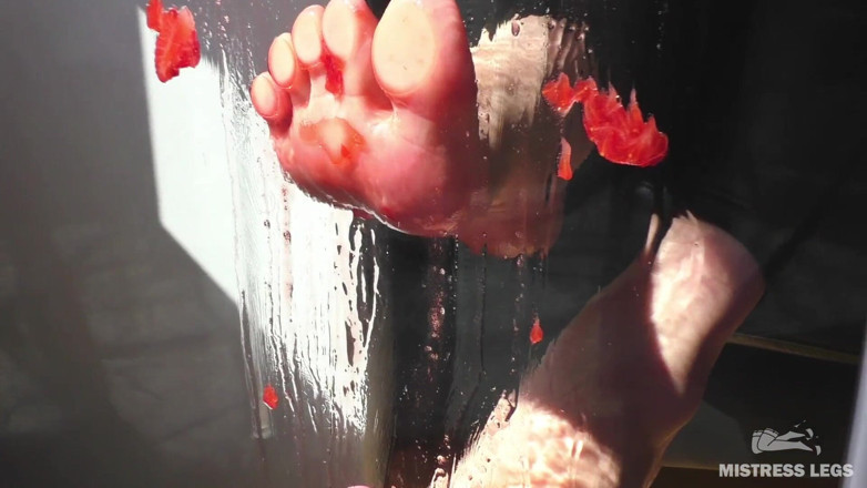 Mistress Legs: Mistress barefoot soles rubbing against the glass and squeezing strawberries