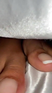 Ebony Girl Under Her Covers in Bed Show off Feet