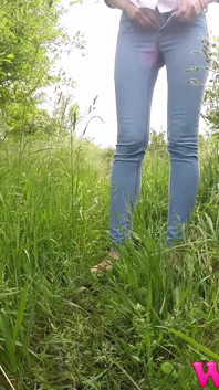 Skinny Brunette with Full Bladder Has to Pee in the Forest and Wet the Tall Grass Touching Her Wet Pussy
